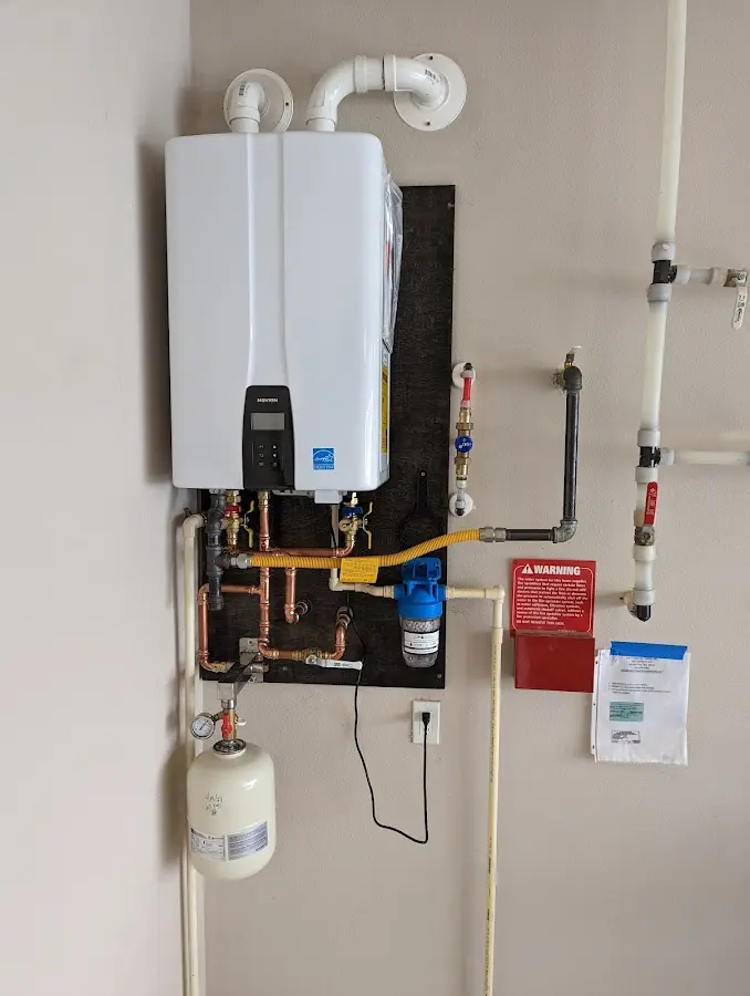 Professional plumber installing copper piping in a Hastings home